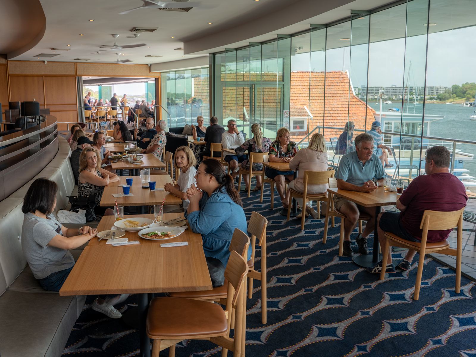 Busy Watergrill dining room with river views, Abbotsford
