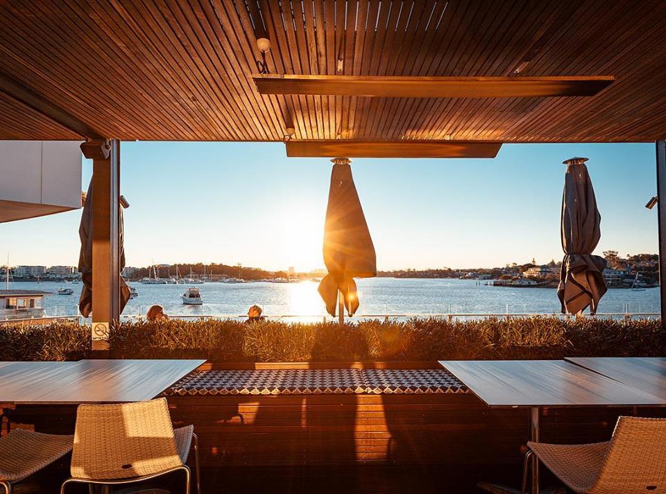 Watergrill deck at sunset overlooking the river, Abbotsford