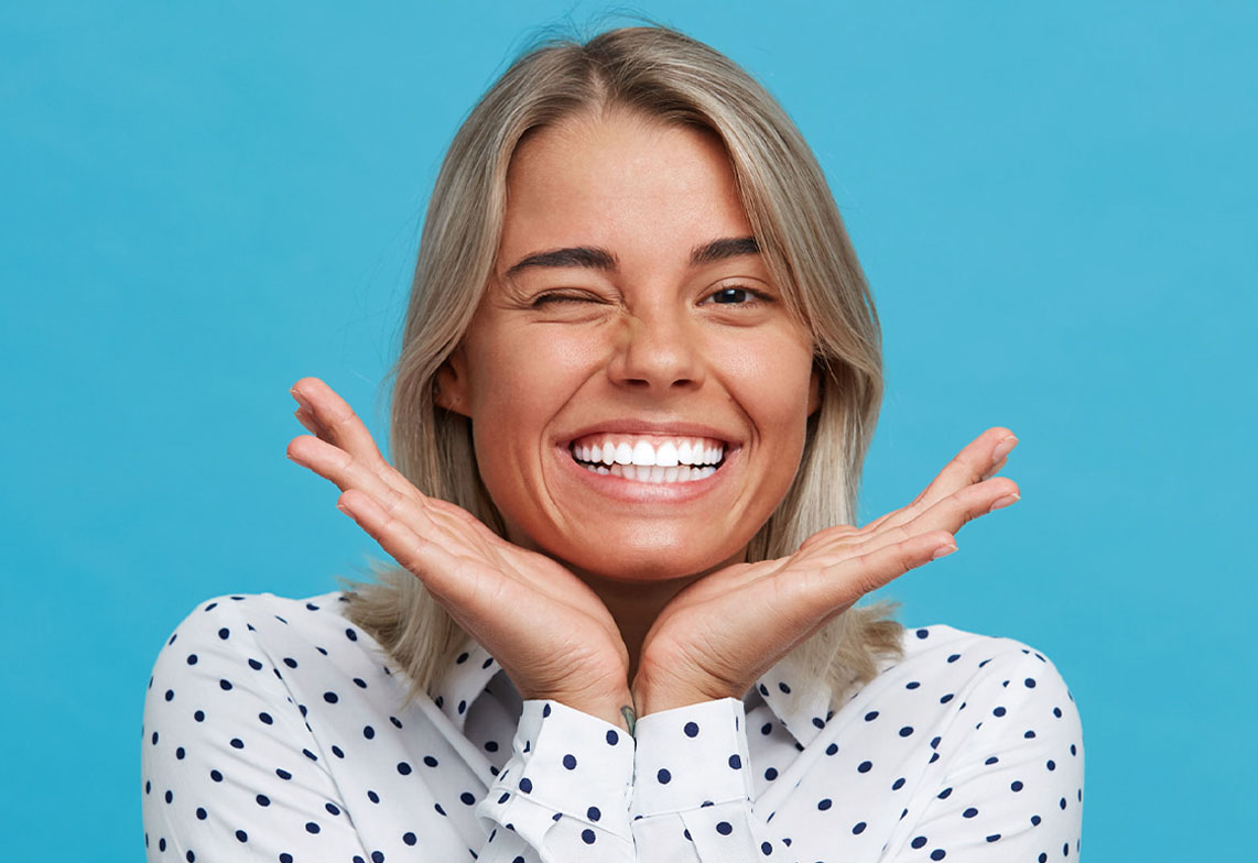 Smiling patient receiving professional teeth whitening in Kanata
