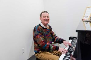 One of our Angeles Academy of Music students enjoying his time learning to play a musical instrument
