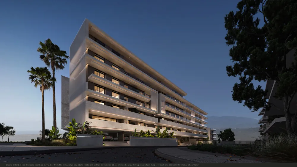 New apartment building with palm trees at dusk in Vouliagmeni, Athens Riviera