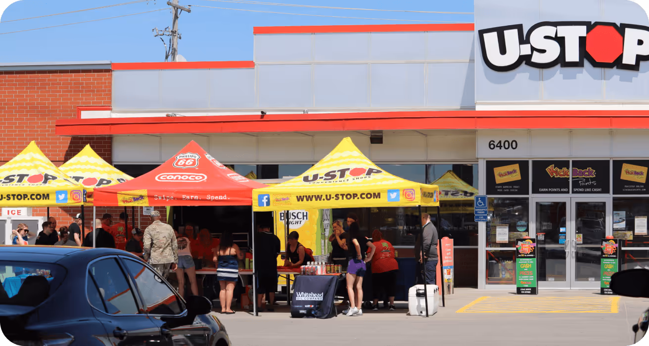 U-Stop Convenience Store with a Kick it Back to community event of people gathering and sampling some of the food and drink deals