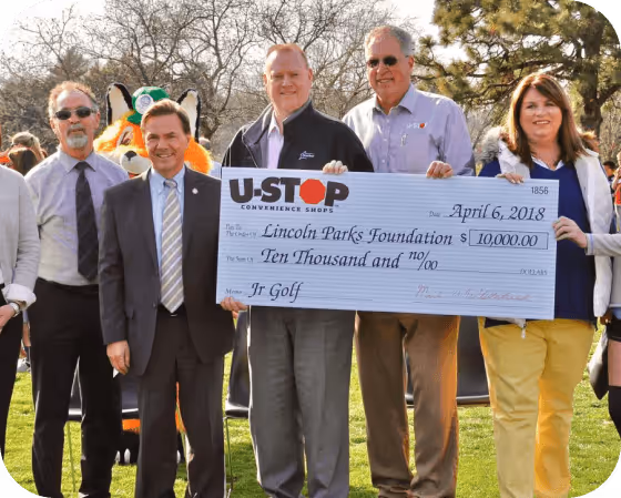 image of mark whitehead and Lincoln Park Foundation CEO holding a check in donation to the park