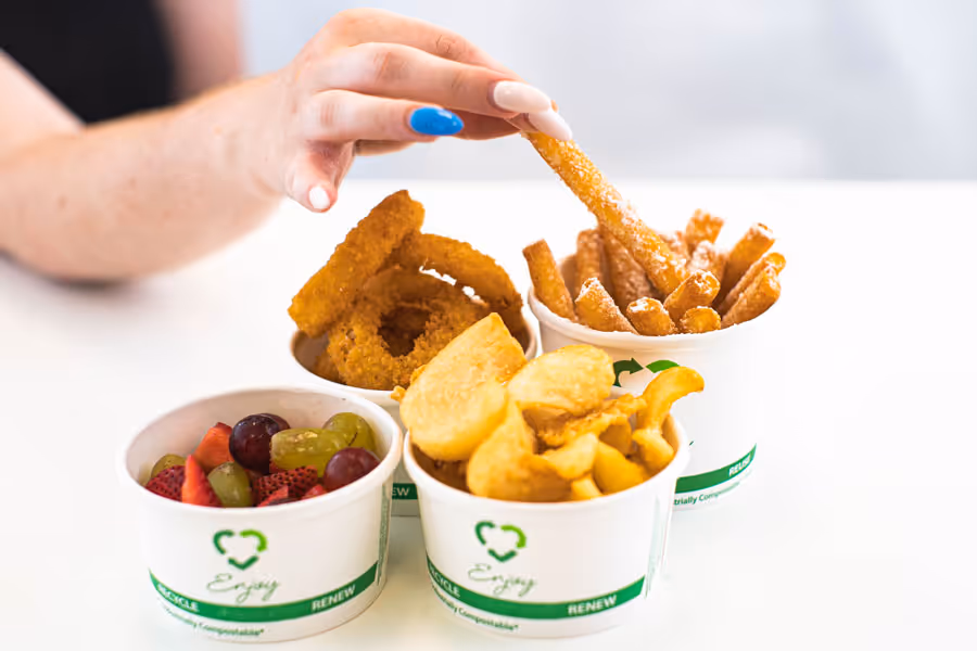 hand reaching for various options of Jeannie's kitchen menu items