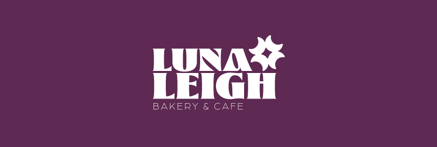 Luna Leigh Bakery & Cafe logo with stylized text and a star-shaped graphic.