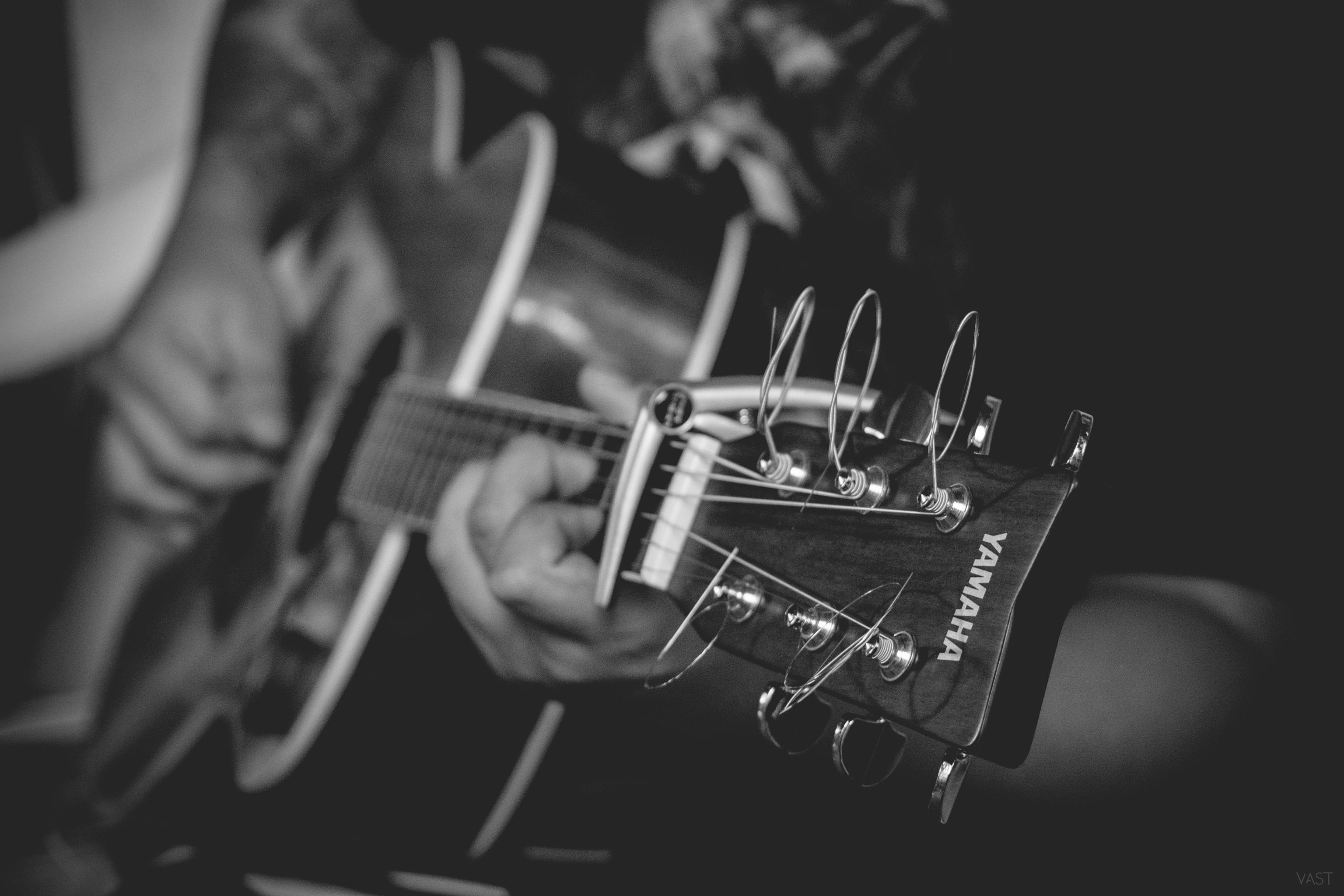 Man playing guitar close up