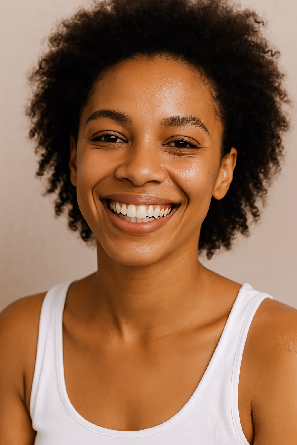 Smiling woman with glowing, healthy skin, representing wellness and natural radiance after treatments like IV Therapy, Chemical Peels, and Hydrafacial at a Tampa medspa.