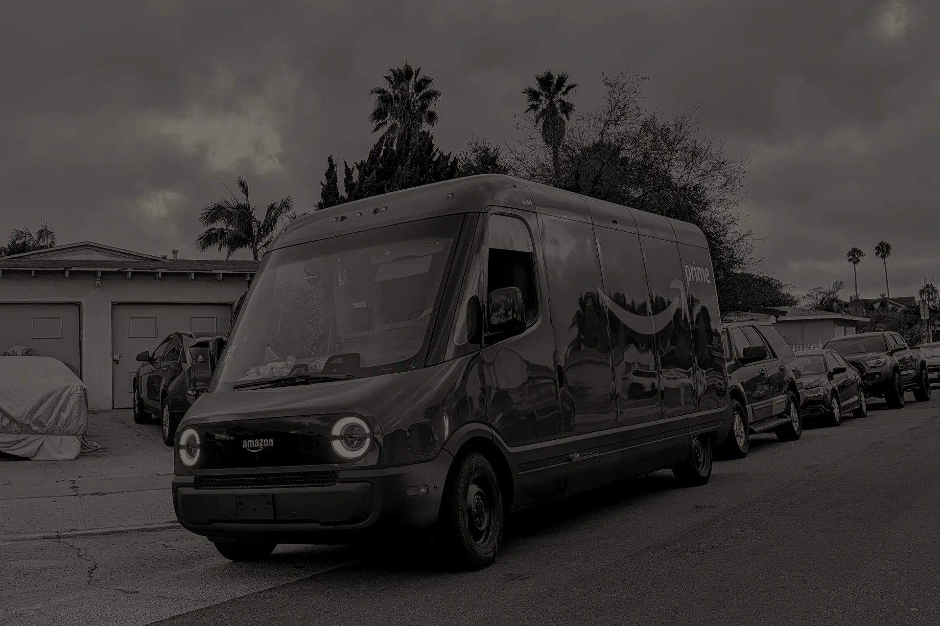 Amazon Prime electric delivery van parked curbside on a residential street in Clairemont, San Diego.