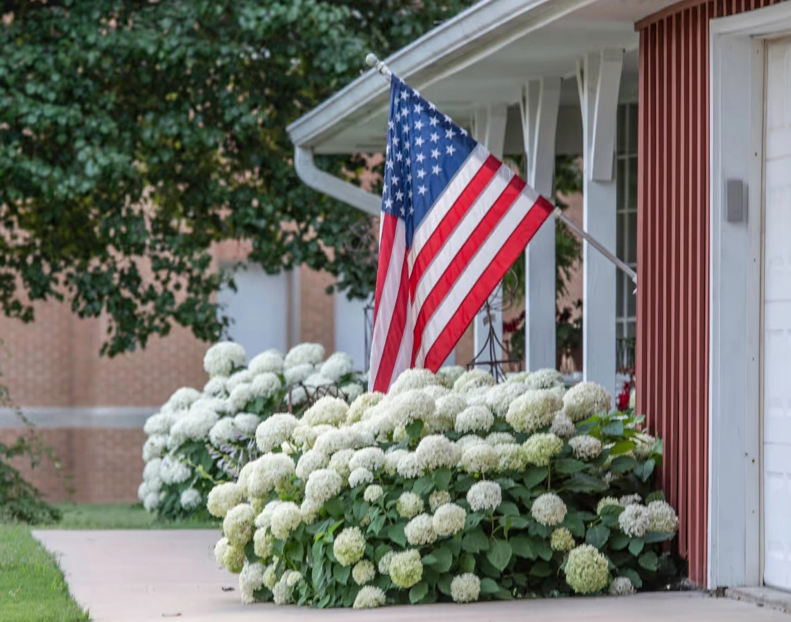 veteran and significant other walking into their new home purchased with a va loan