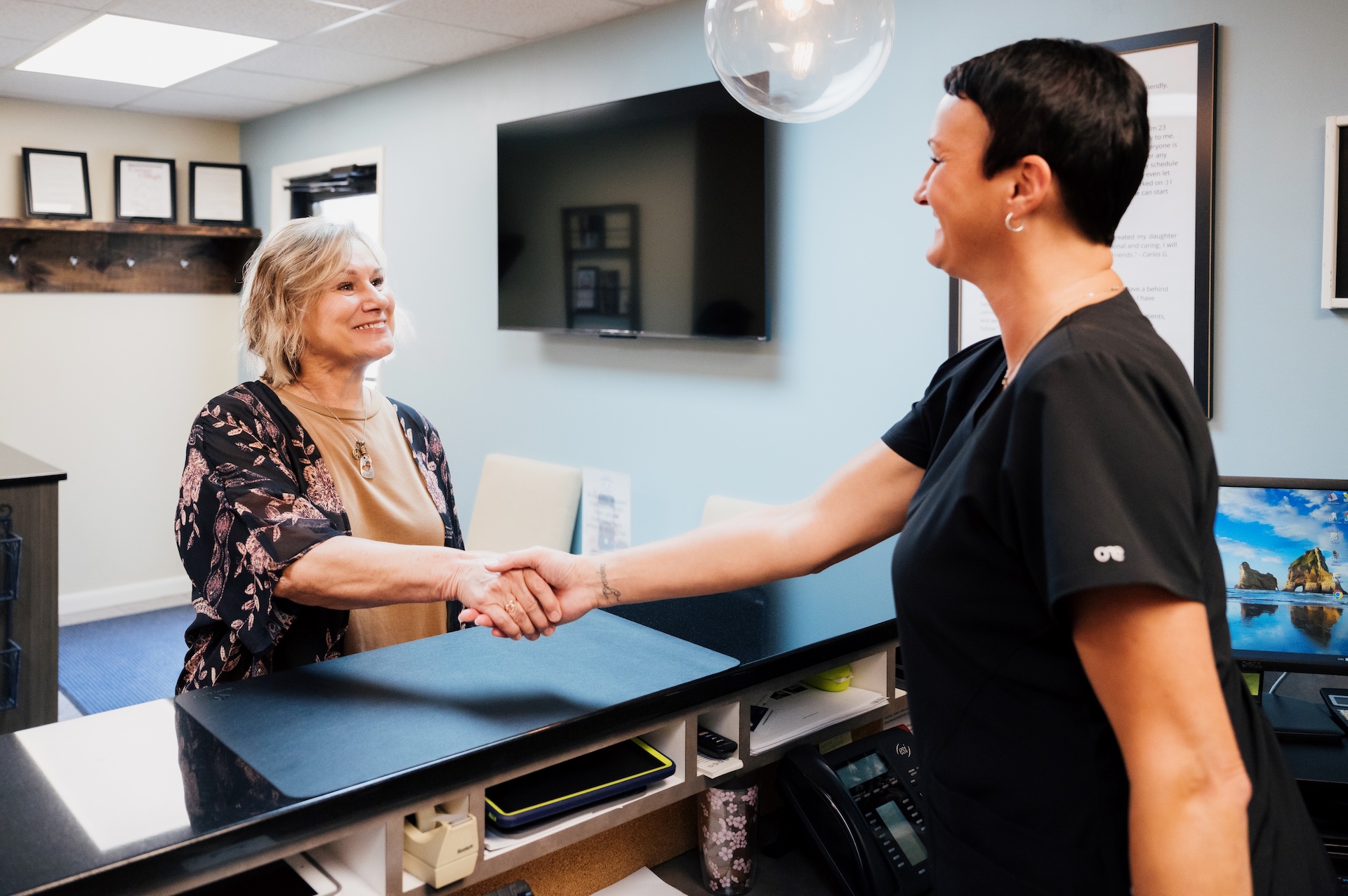 Our welcoming team greeting a patient coming in for dental crowns