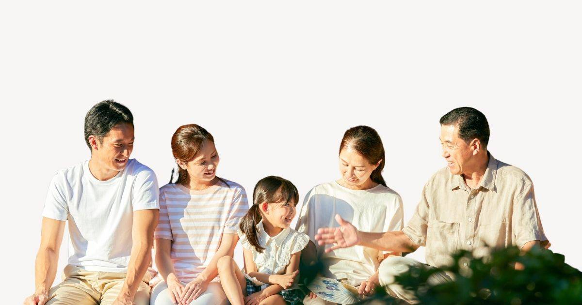 A family of three generations are pictured talking