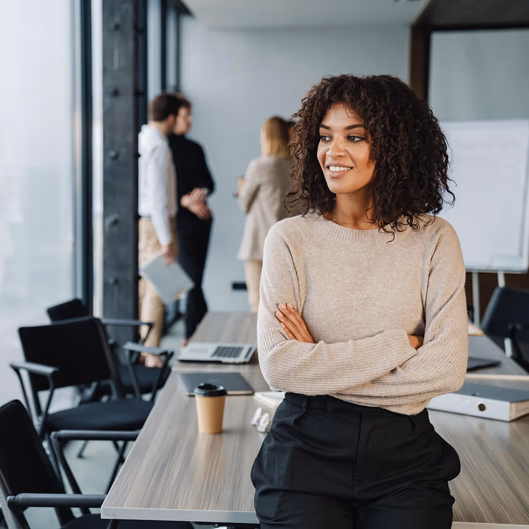 a woman in a conference room looking out the window