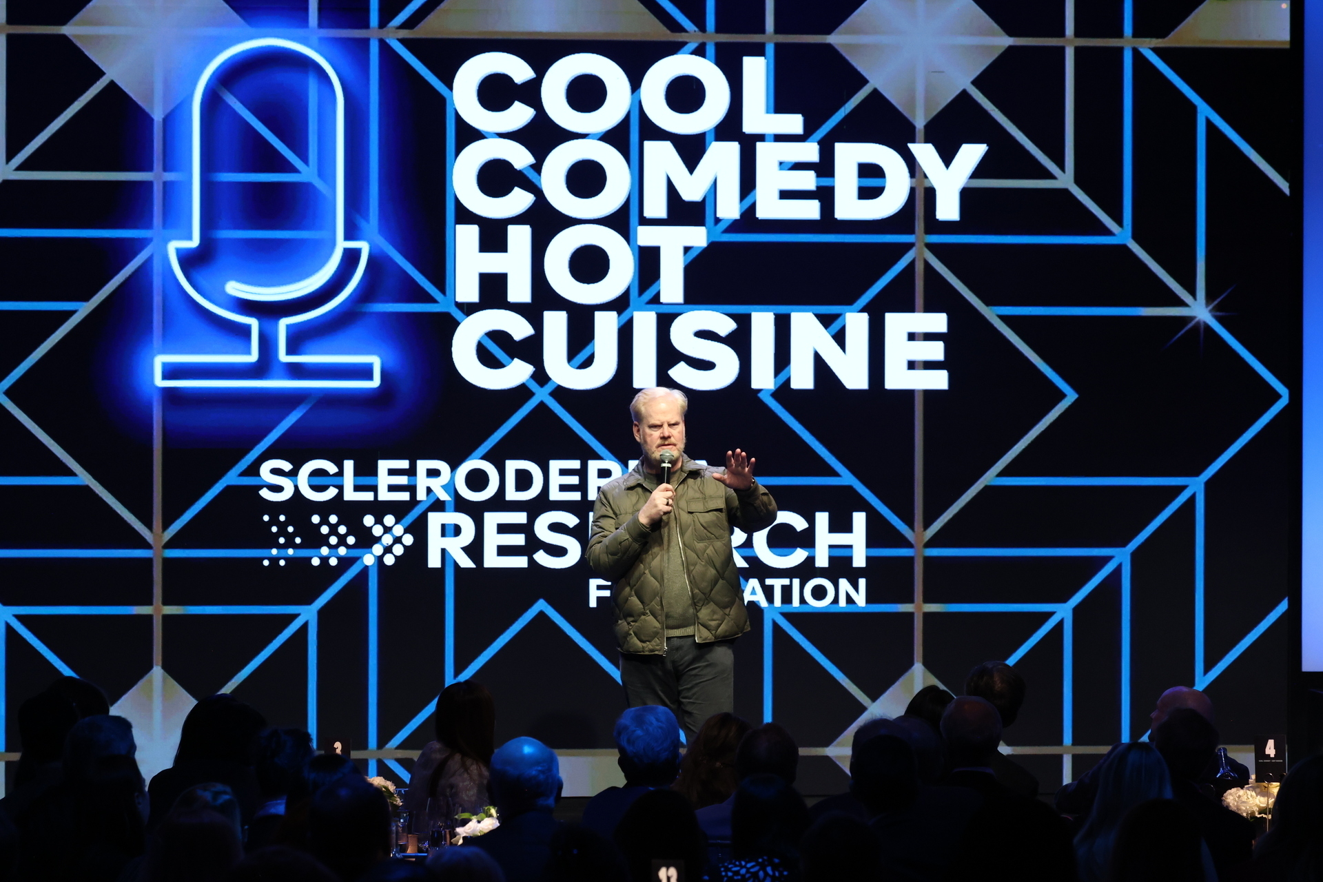 NEW YORK, Nov. 12, 2025 — Jim Gaffigan speaks onstage during the Scleroderma Research Foundation’s Cool Comedy • Hot Cuisine event at the Edison Ballroom in New York City. (Photo by Kevin Mazur/Getty Images for the Scleroderma Research Foundation) / Source: Scleroderma Research Foundation (SRF) (EZ Newswire)