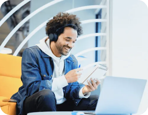 Young man with headphones looking at mobile device