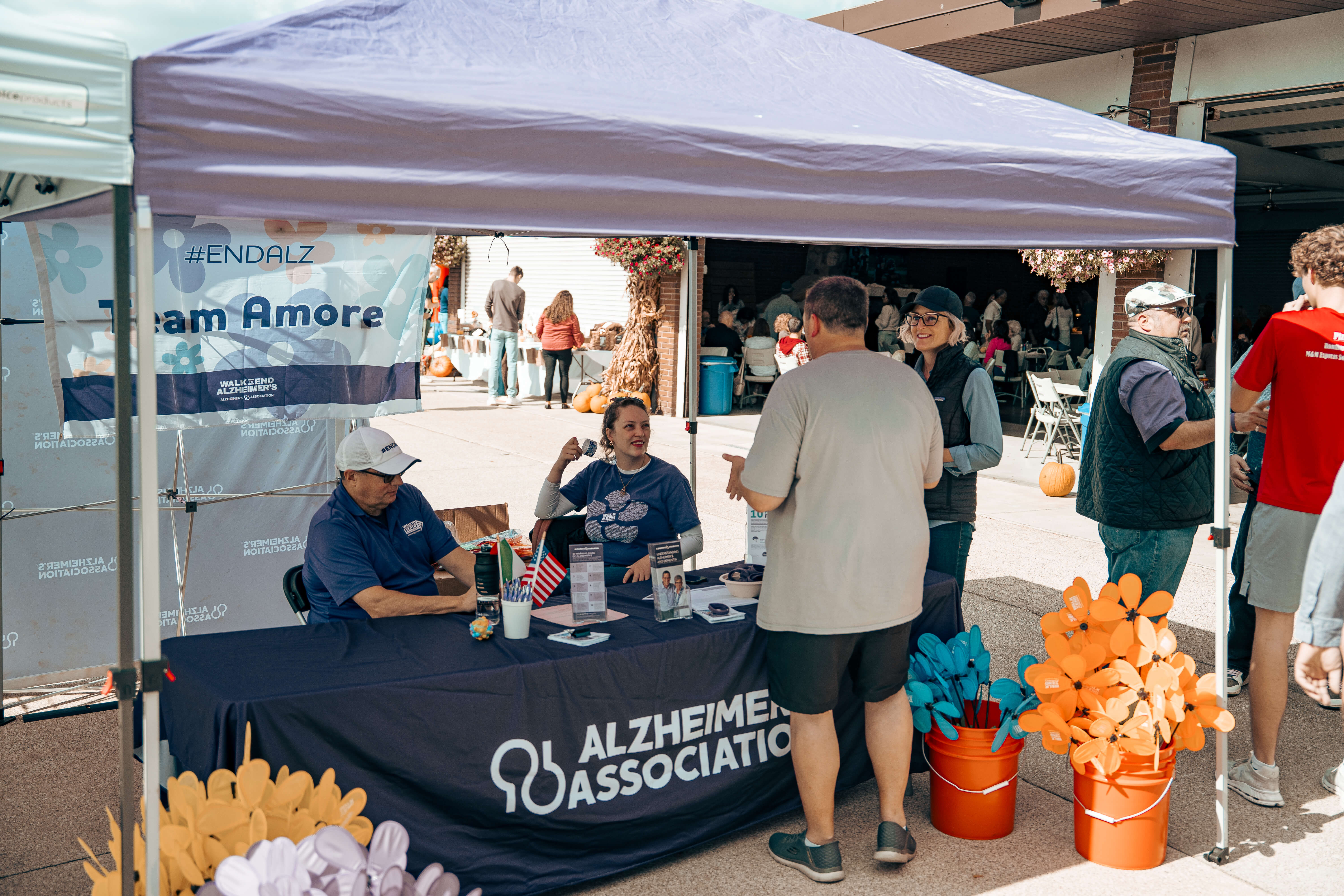 Alzheimer's Association awareness event with volunteers at information booth