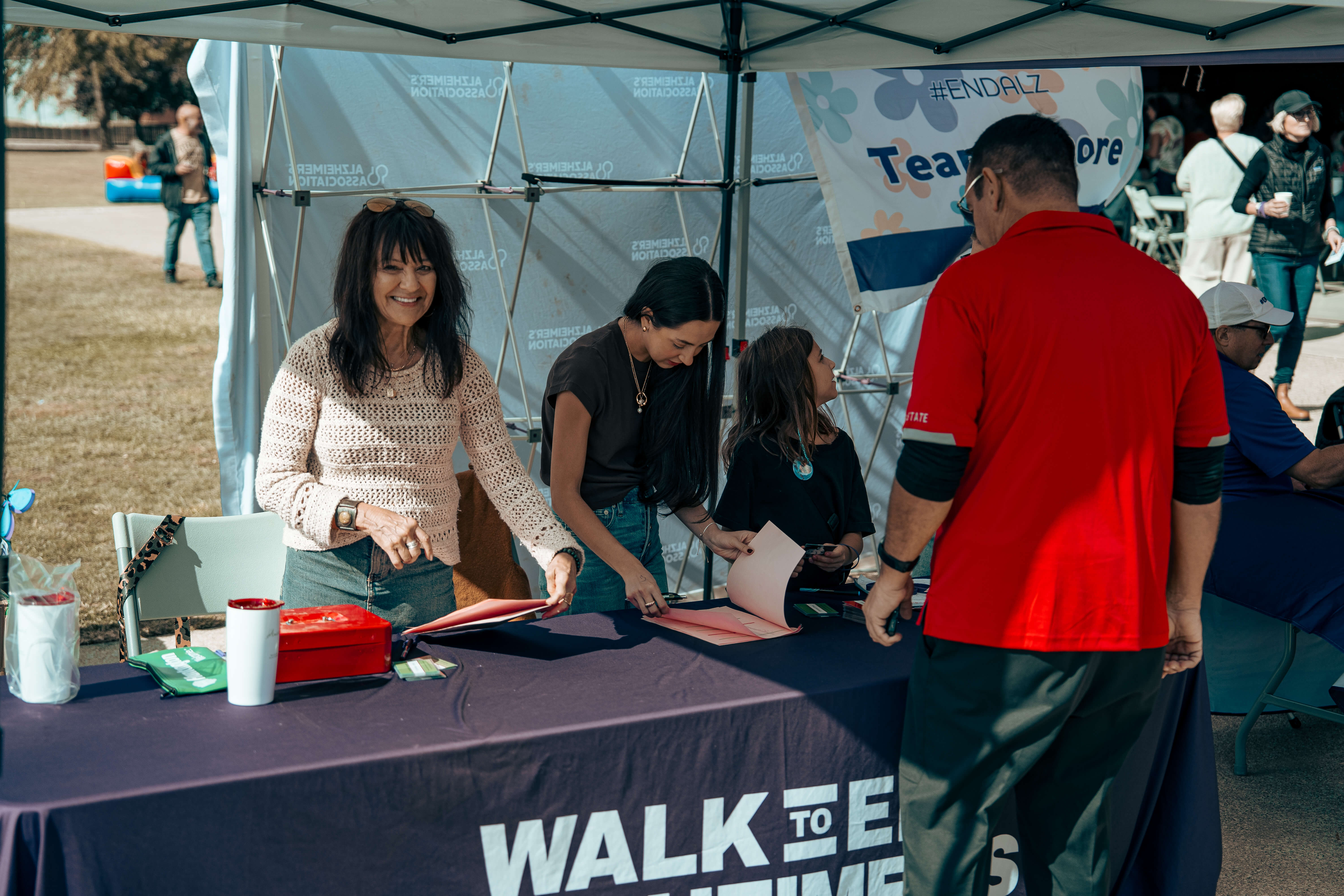 Walk to End Alzheimer's event volunteers managing registration table