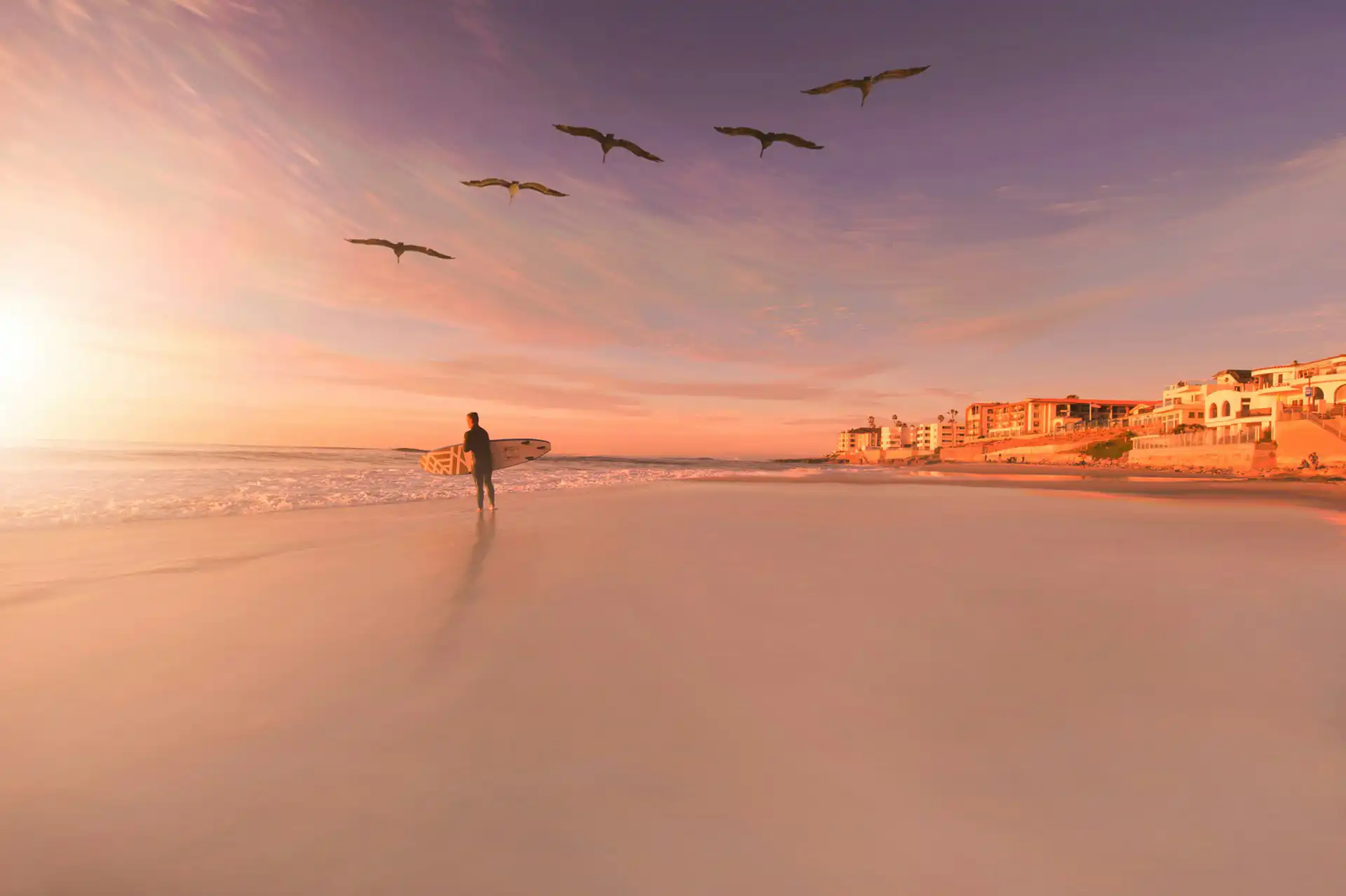 Surfer on the sand in San Diego
