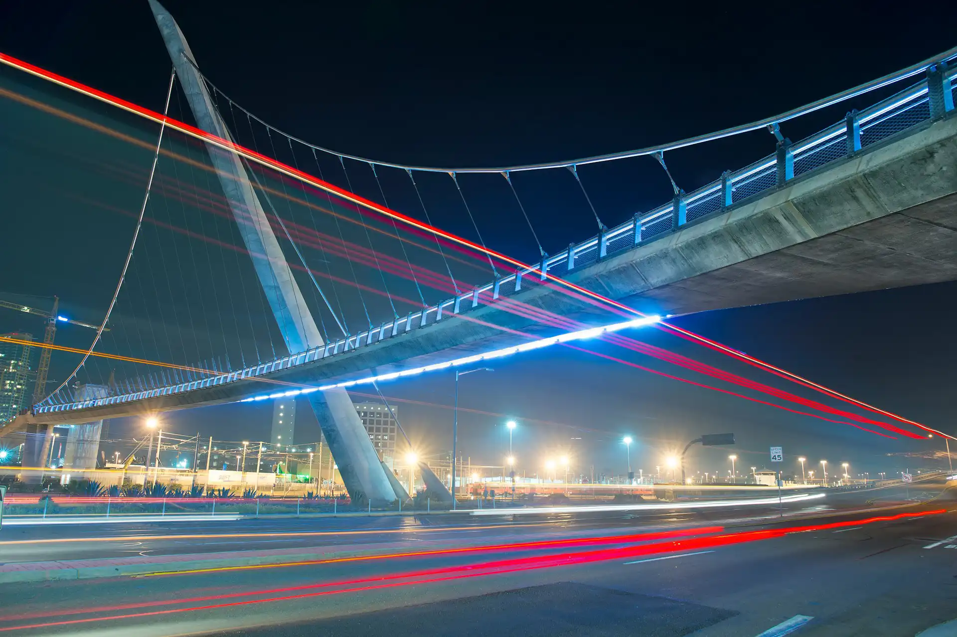 San Diego downtown pedestrian bridge over traffic at night