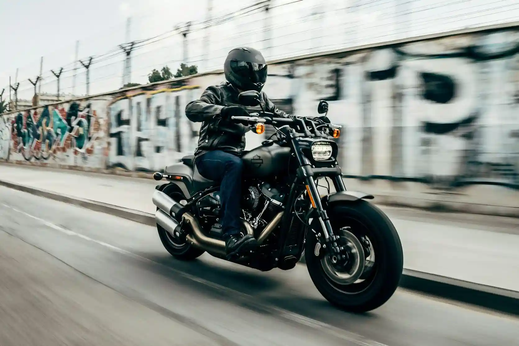 Motorcyclist riding down a street in San Diego