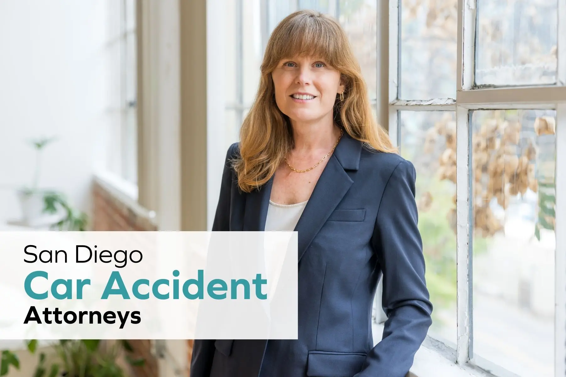 San Diego car accident attorney Leslie Hulburt standing in an office