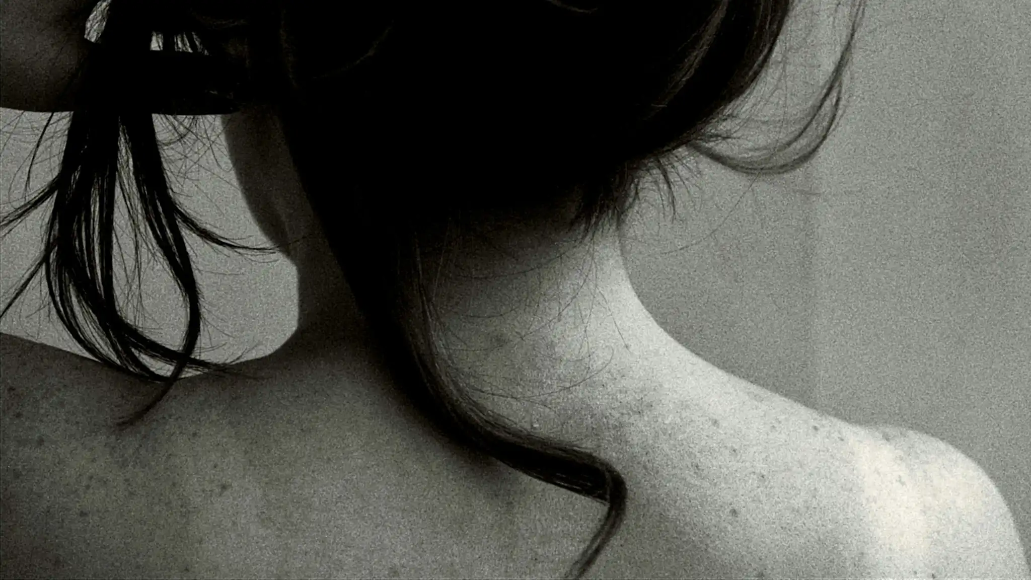 Image of a woman holding her neck