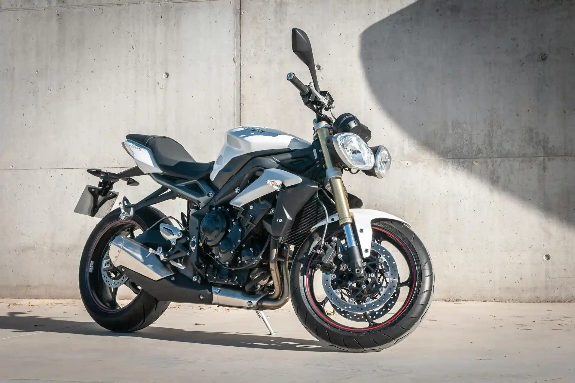 Required motorcycle equipment including rearview mirrors shown on a California road