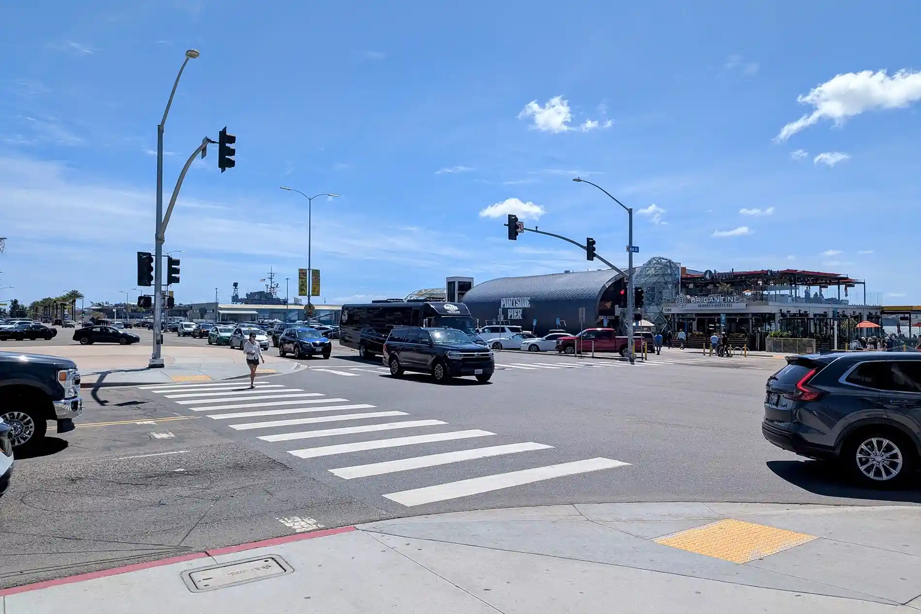 Pedestrian crossing at a marked crosswalk in San Diego illustrating California right-of-way laws