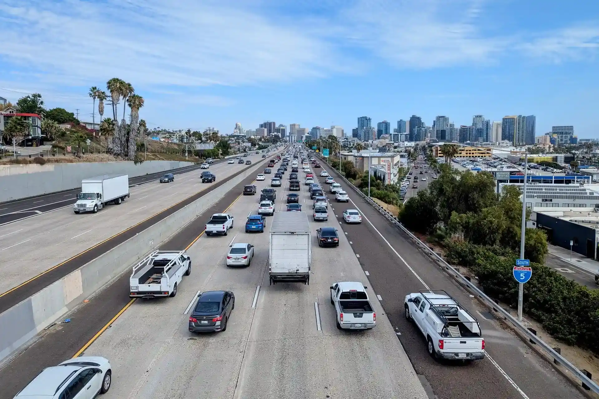 Box truck and commercial traffic on southbound Interstate 5 approaching downtown San Diego.