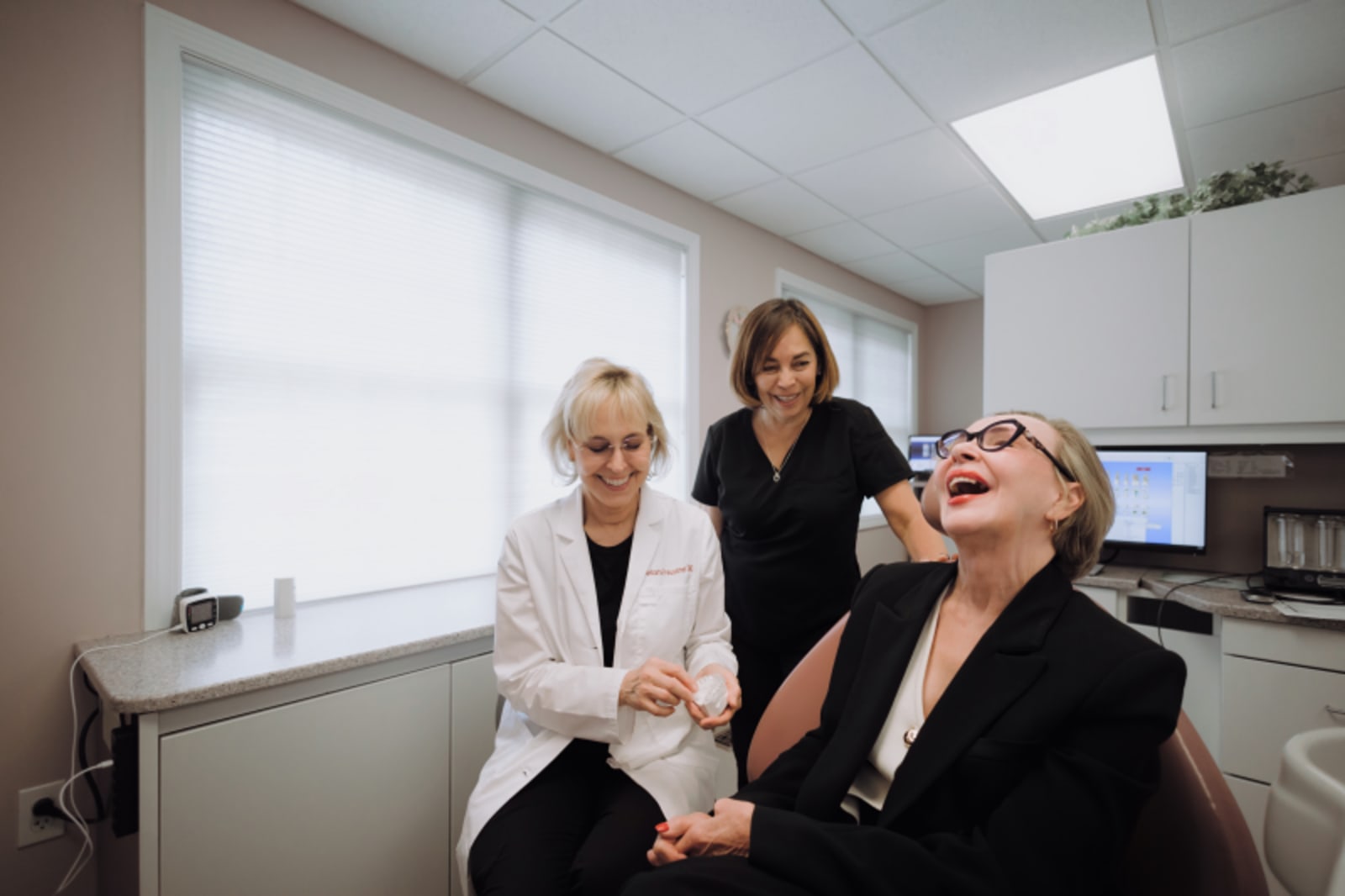 Dr. Preussner consulting with patients in a clinical setting