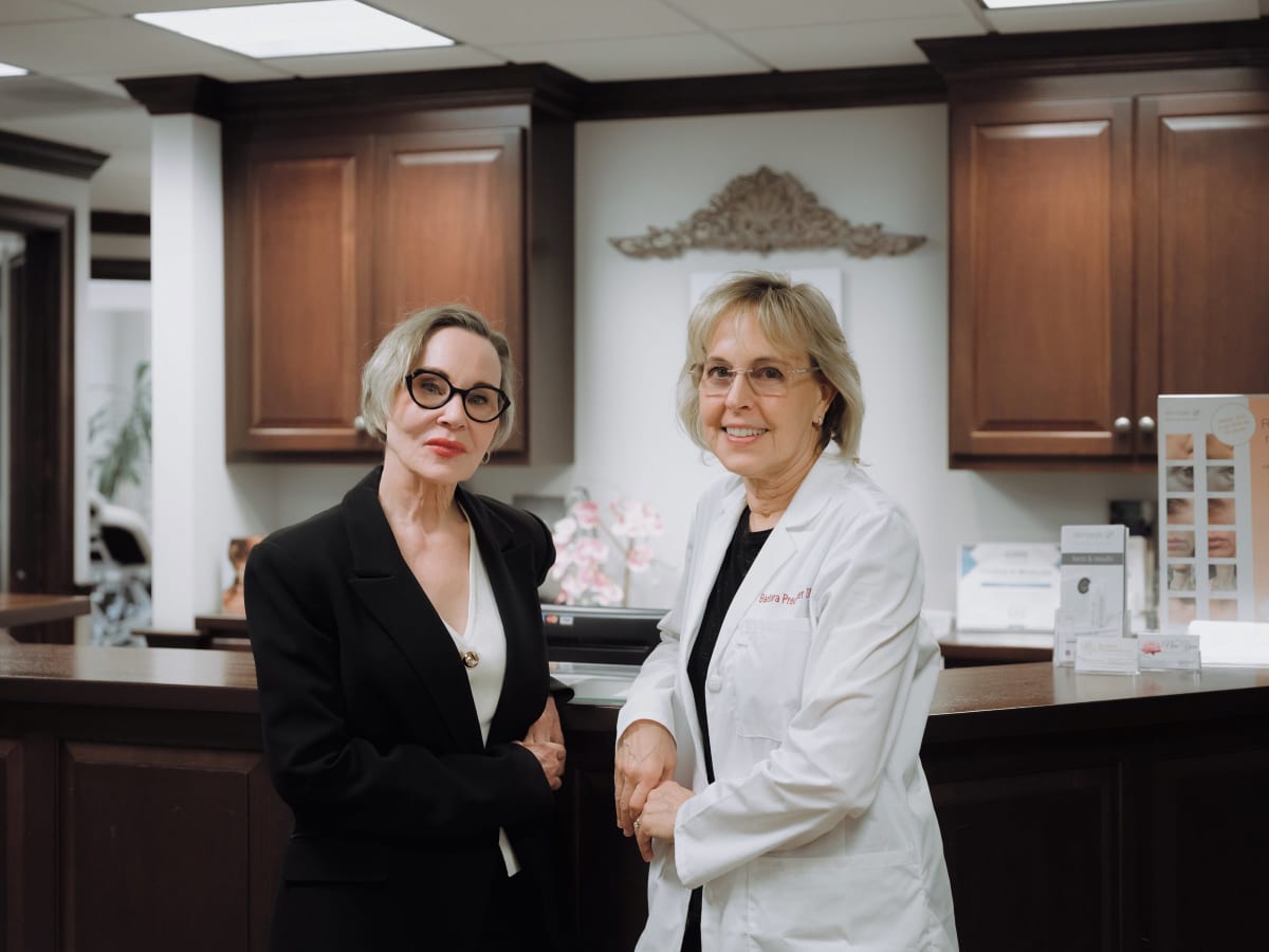 Dr. Barbara Preussner consulting with a patient in the treatment room