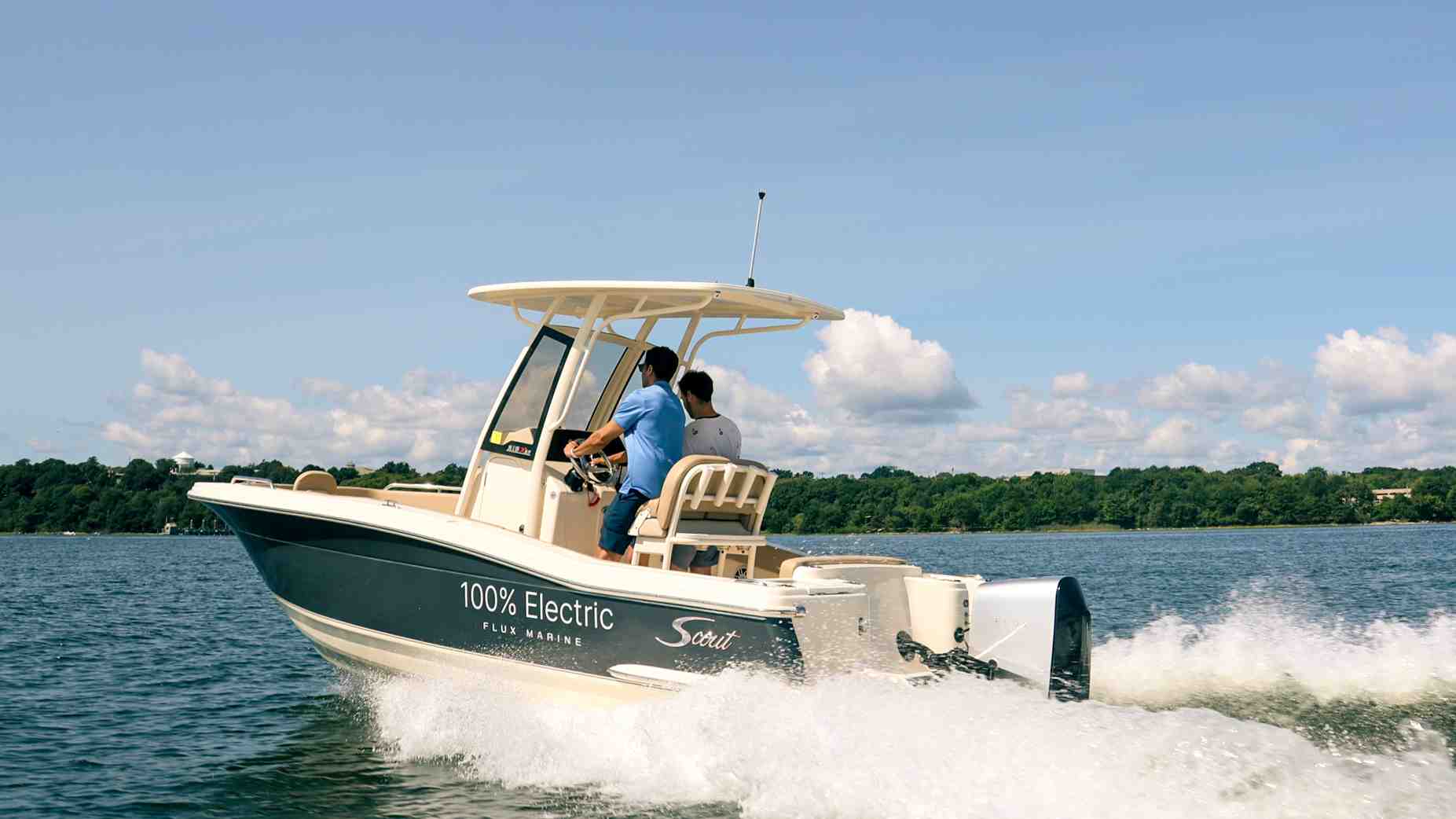 a boat moving quietly on the water with a Flux Marine outboard - electric boat conversion