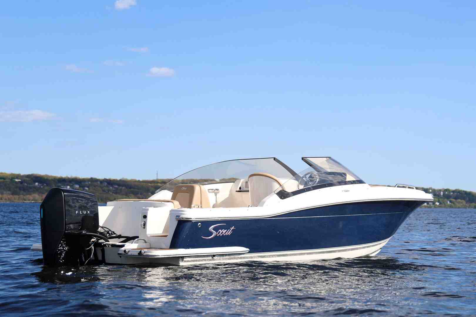 electric outboard on runabout at lake house - electric boats for lakes