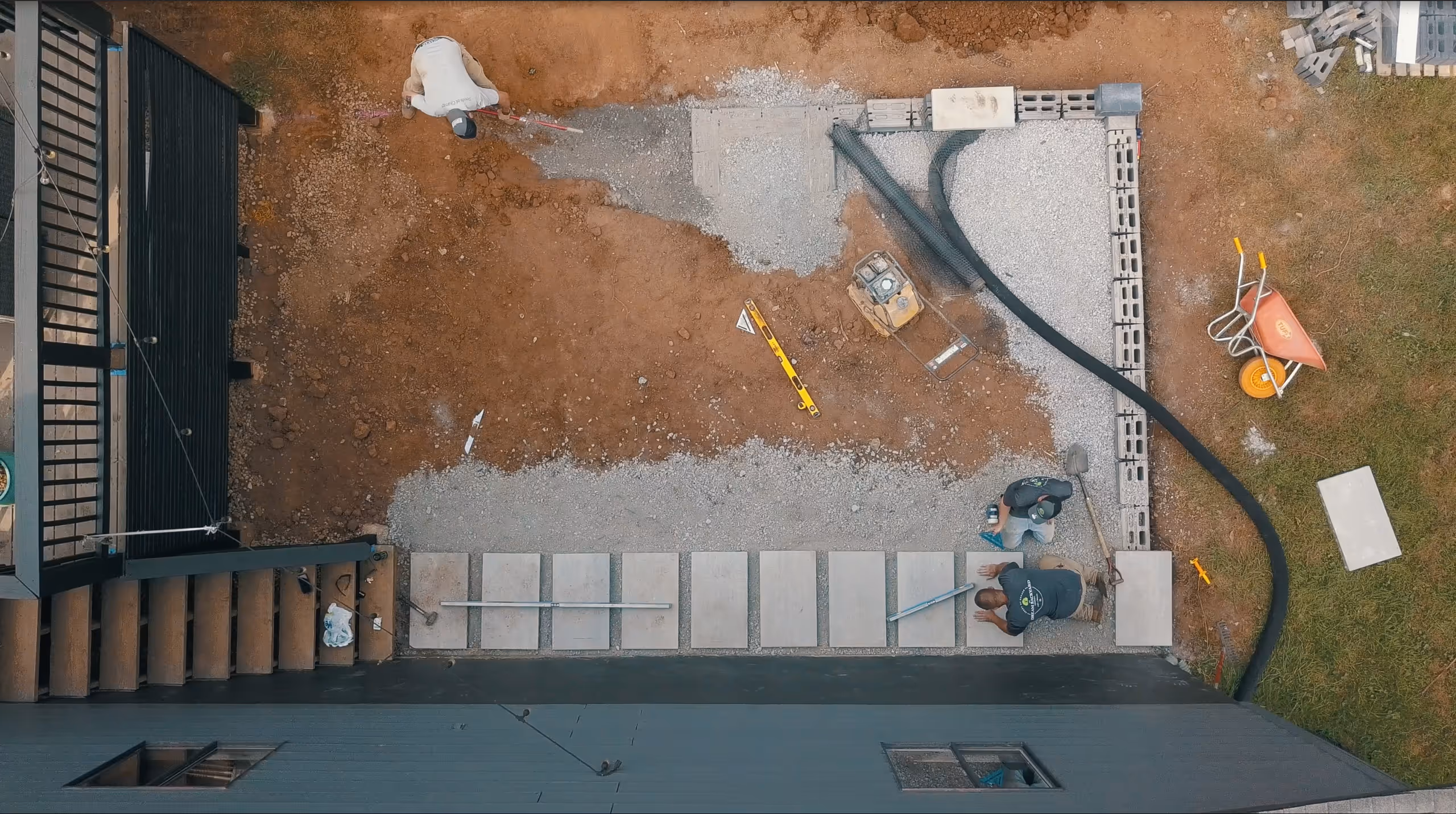 A construction site with a concrete slab being poured