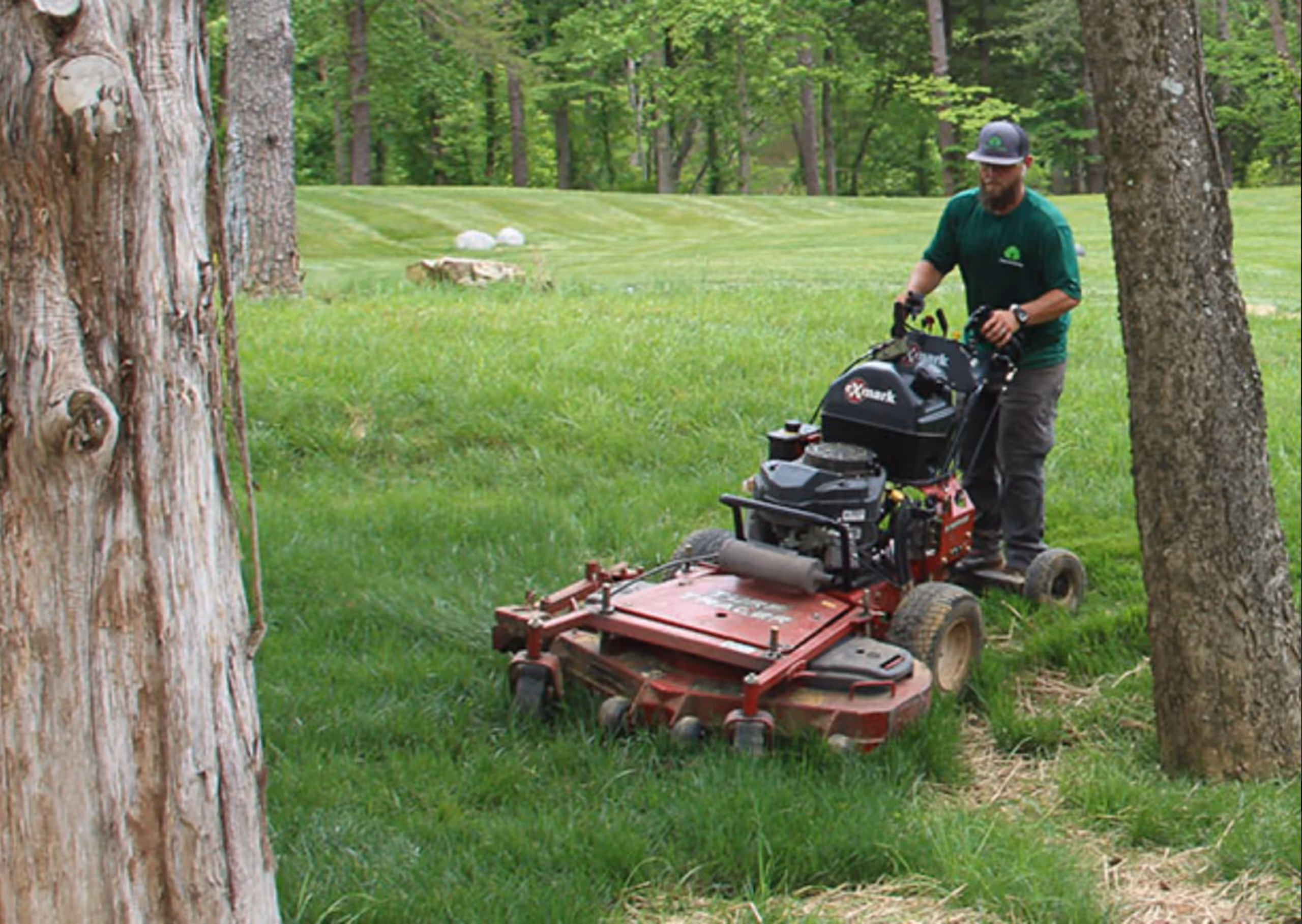 A man mowing grass