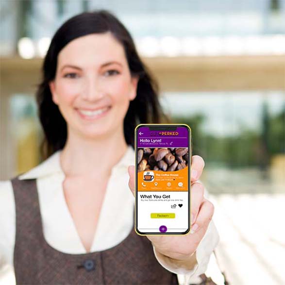 Lady holding smartphone displaying a mobile coupon