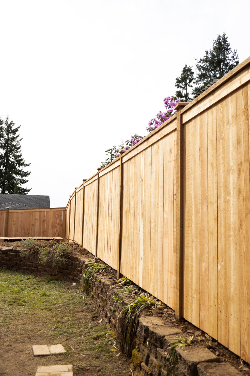 Close-up of treated wood fence boards during construction