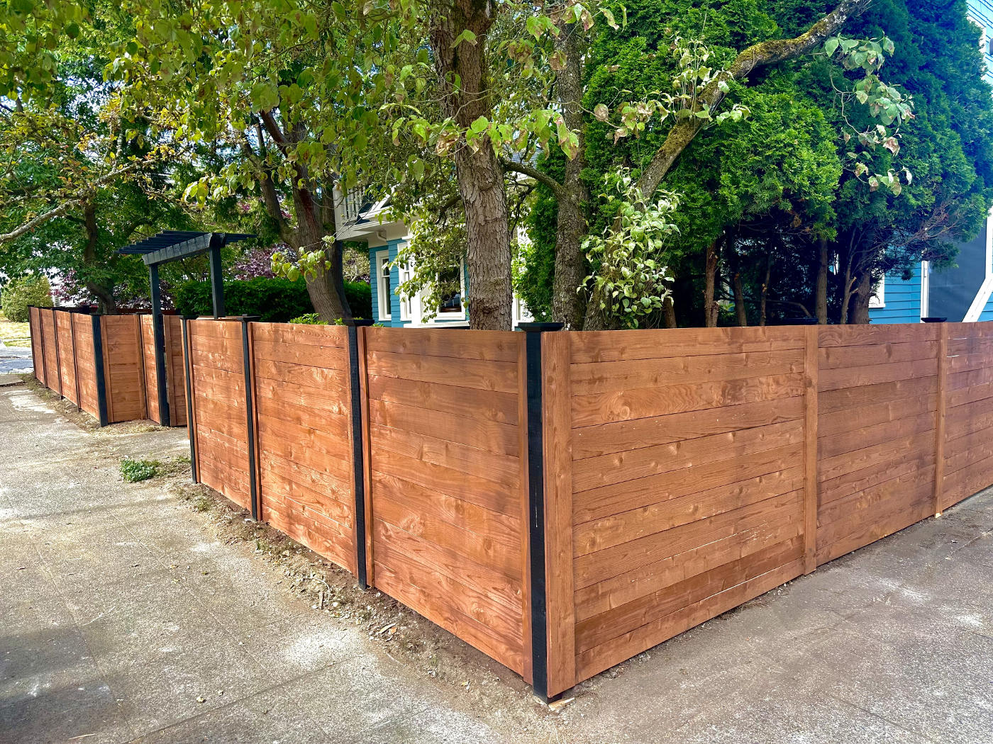 Close-up of treated wood fence boards during construction