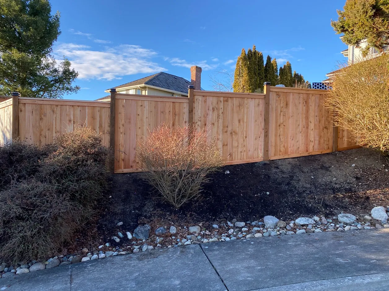 Lexington fence following sloped ground behind a Seattle-area home