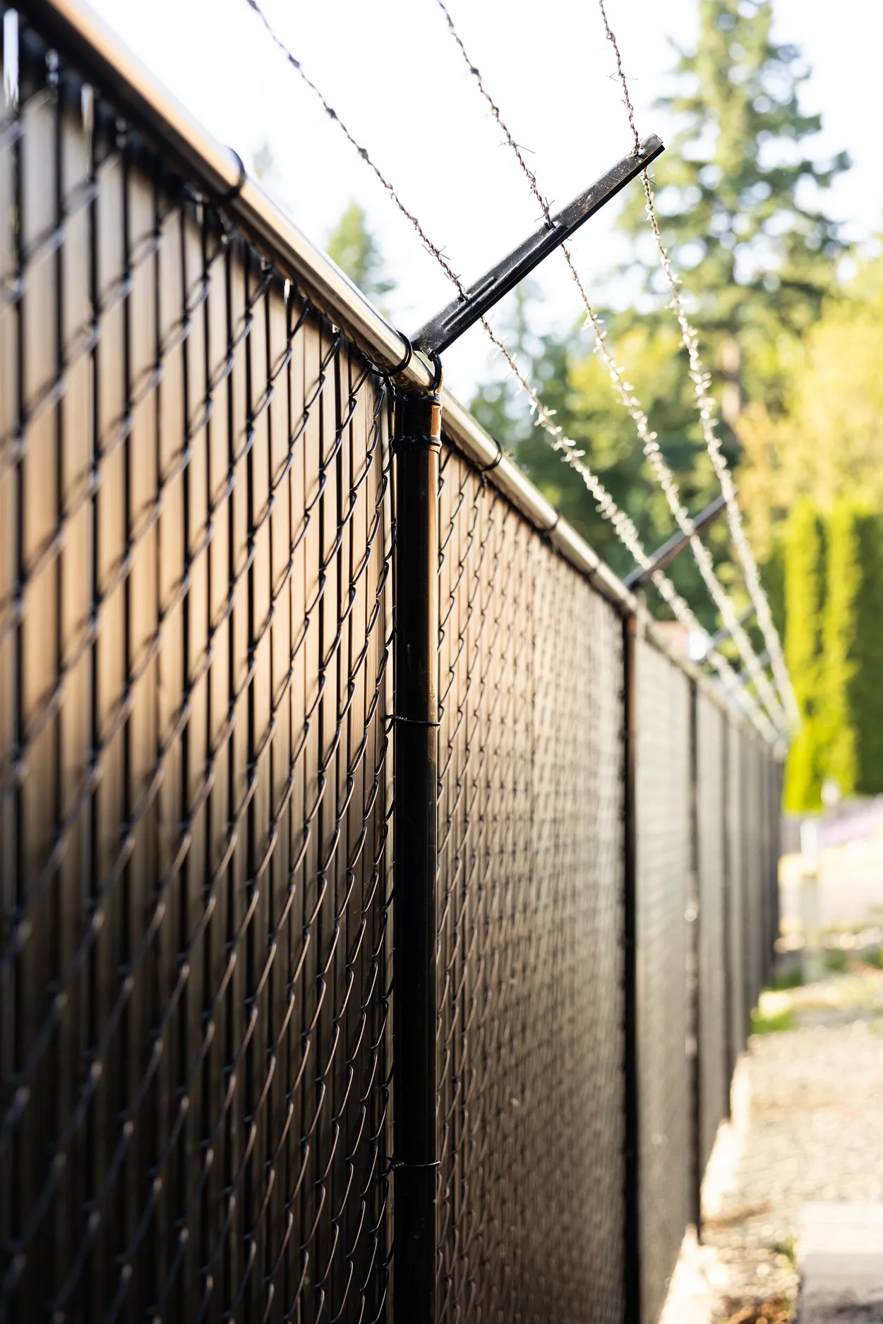 Heavy-duty security chain link fence with industrial-grade posts enclosing a commercial perimeter in Seattle