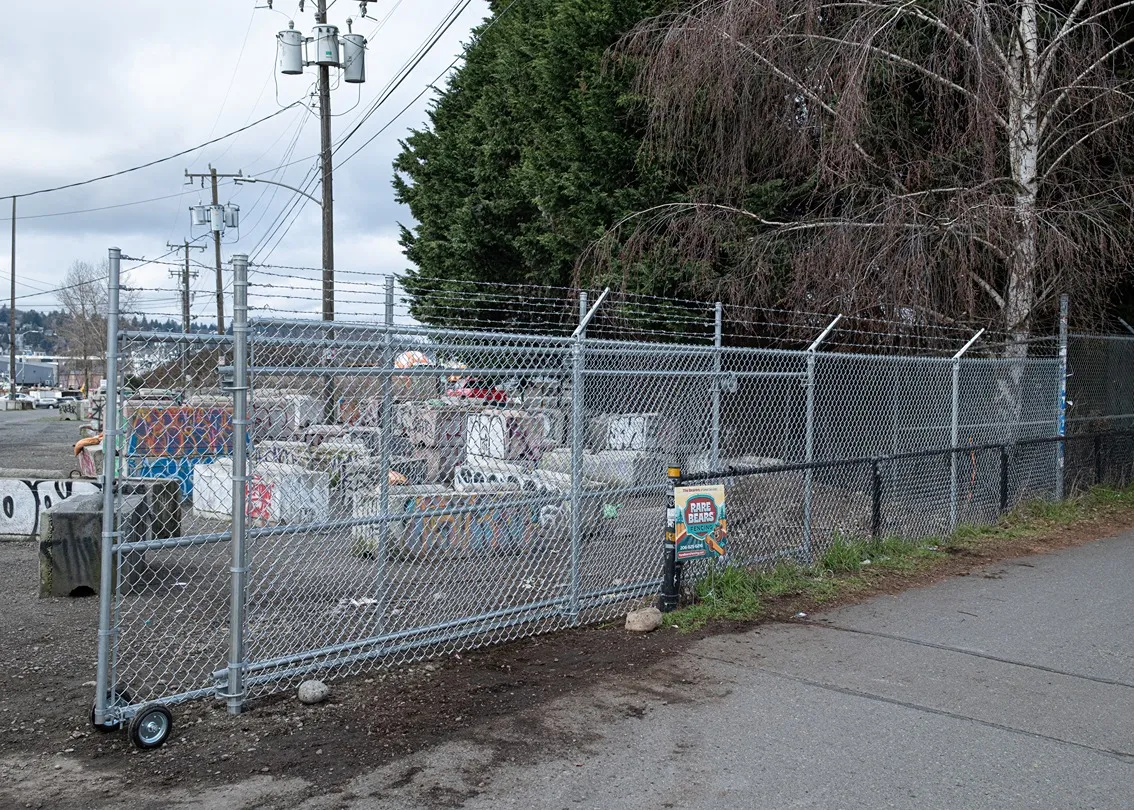 Completed commercial chain link security fence installation with clean post alignment in the greater Seattle area