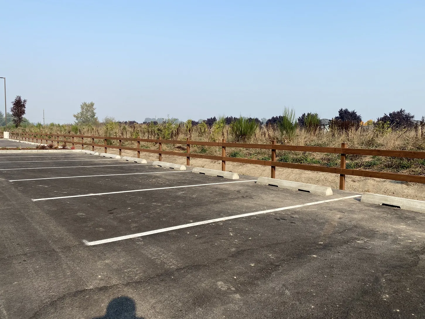Split rail wood fence with natural timber rails set in a residential yard in the greater Seattle area