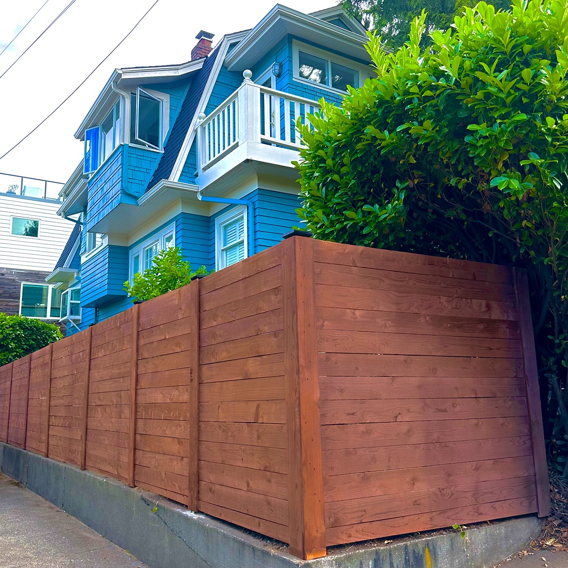 AFTER - Custom Horizontal Cedar Fence with Black Posts in Seattle
