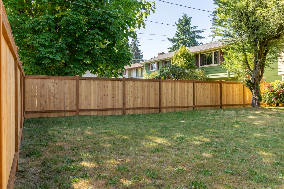 Full panel cedar privacy fence enclosing backyard in Shoreline WA