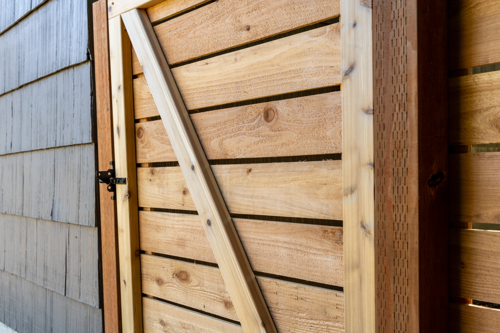 Side view close-up of horizontal cedar fence board alignment