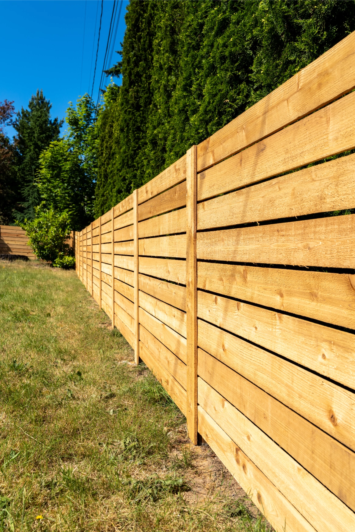 Side view detail of horizontal cedar privacy fence craftsmanship