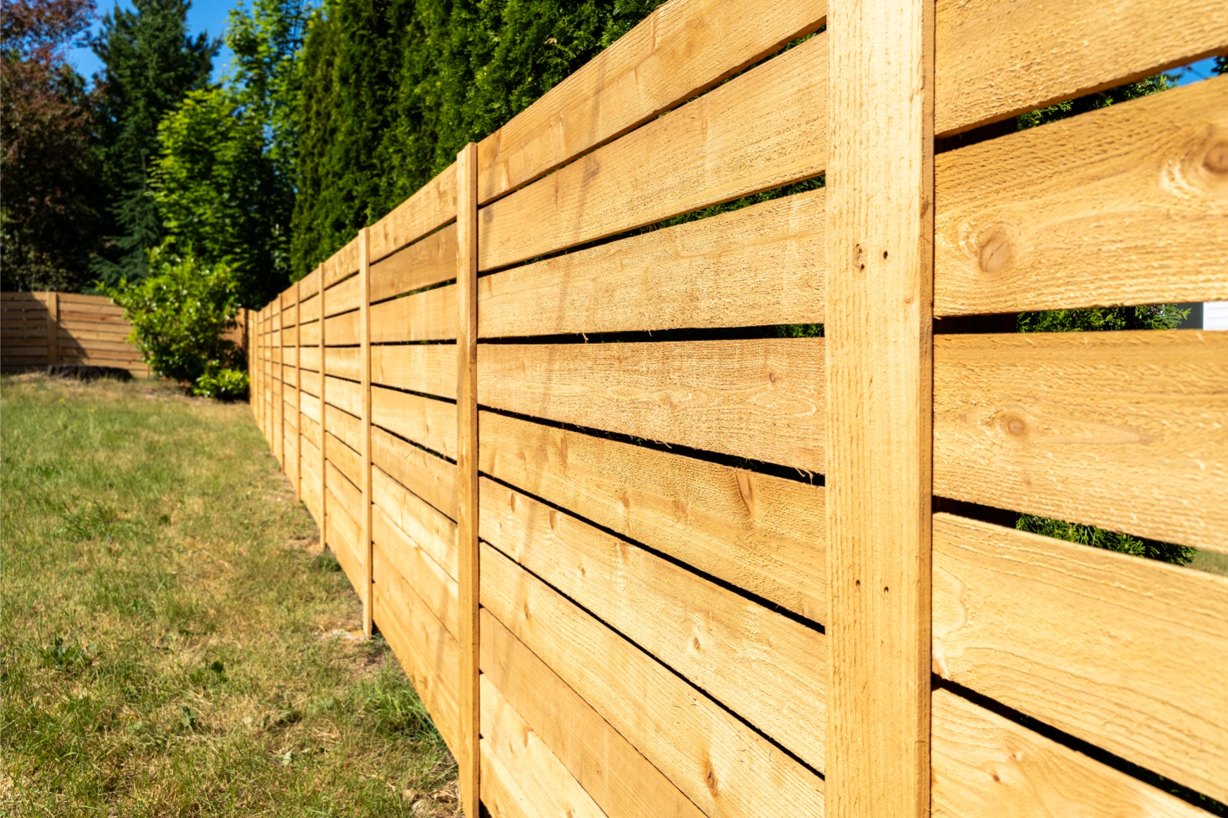 Side view detail of horizontal cedar privacy fence craftsmanship