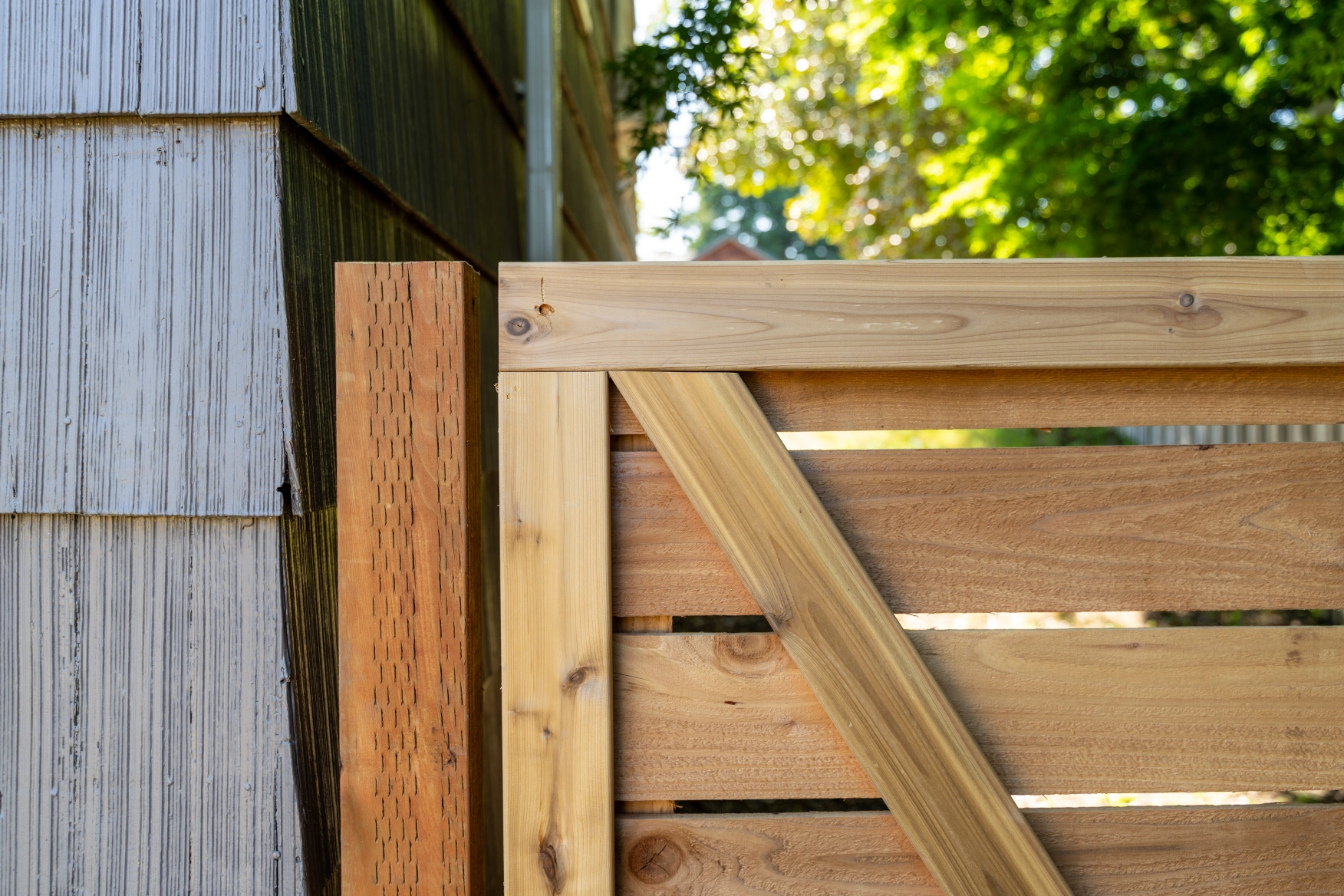 Horizontal cedar privacy gate with clean modern framing in Shoreline WA