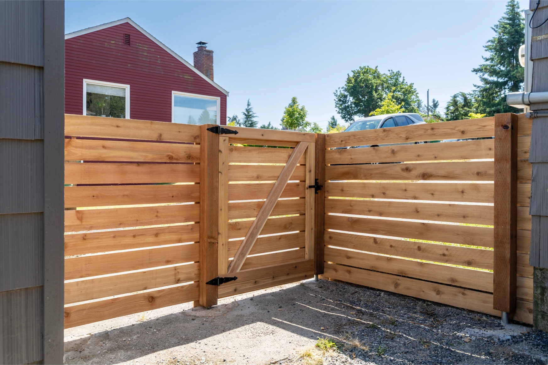 Side view of horizontal cedar privacy gate with smooth operation