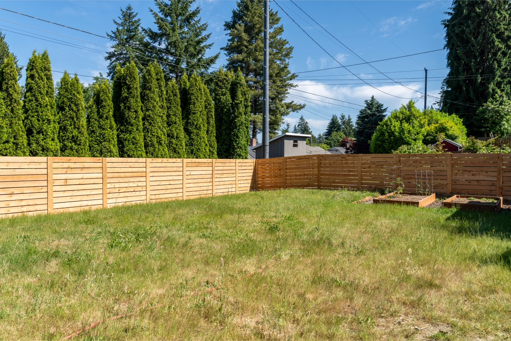 Backyard privacy created with horizontal cedar fence in Shoreline Washington