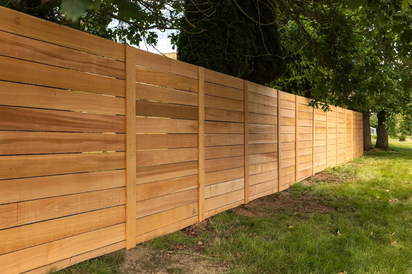 A cedar fence enclosing a property while also compliant with fence height limit in Washington